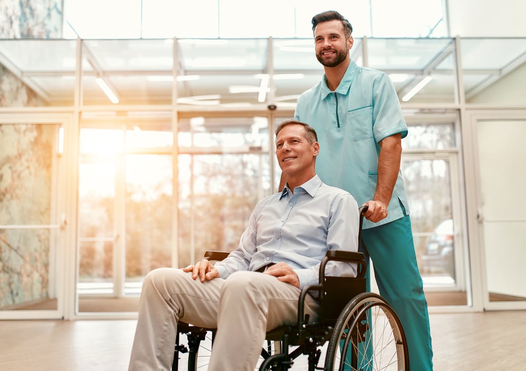 Person pushing someone in a wheelchair